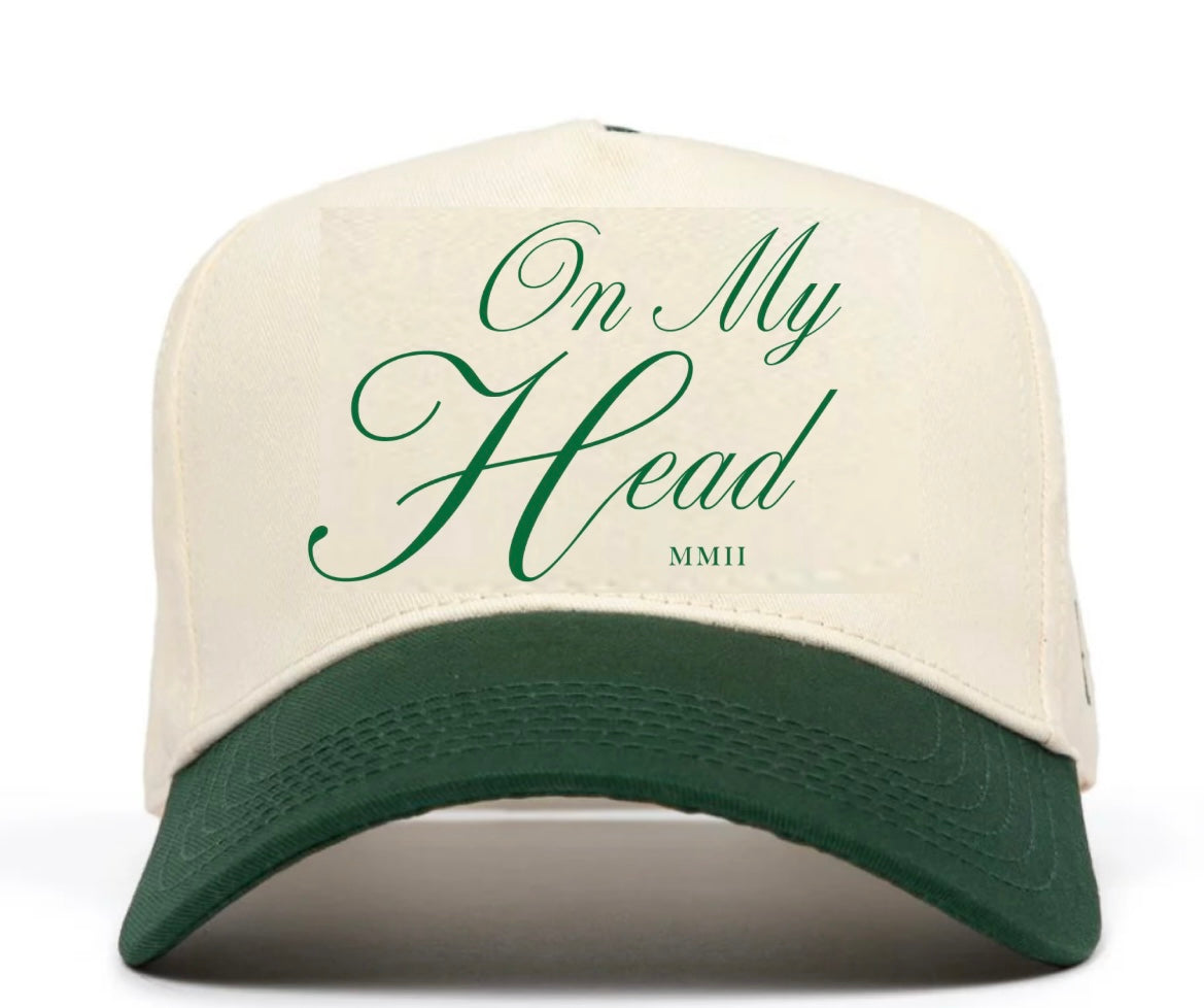 Cream baseball cap featuring elegant text "On My Head"